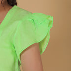 ASYMMETRICAL BUTTON TOP