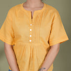 PLEATED YOKE TOP
