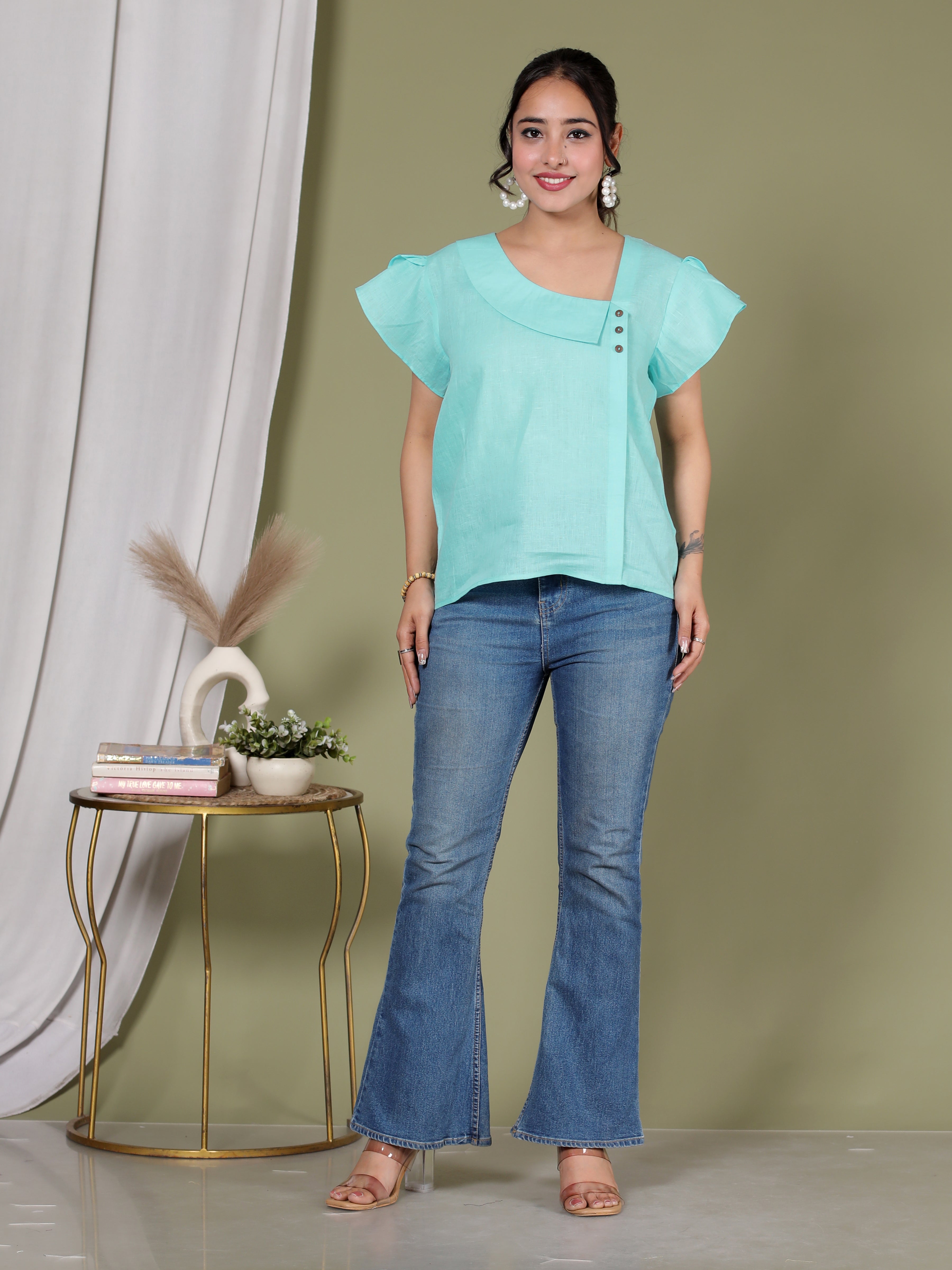 ASYMMETRICAL BUTTON TOP