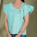 ASYMMETRICAL BUTTON TOP