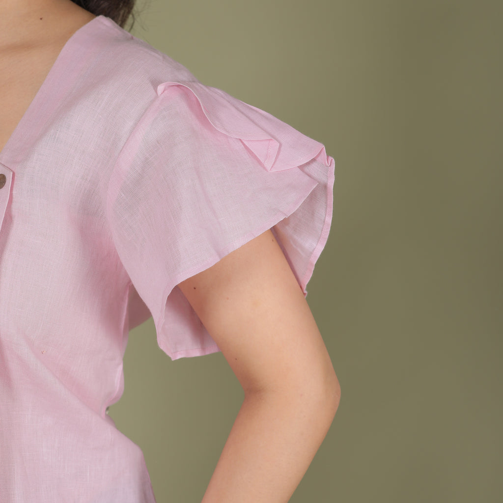 ASYMMETRICAL BUTTON TOP